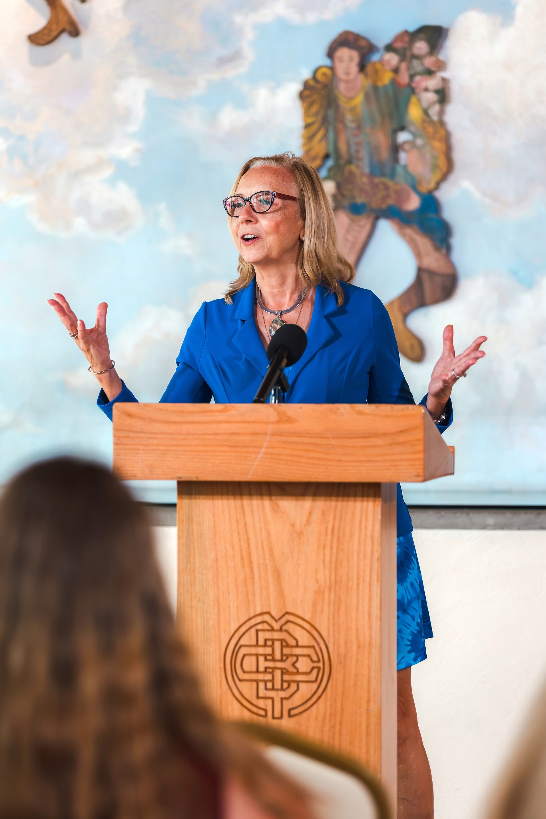 Dr. Grazyna Pajunen speaking on stage